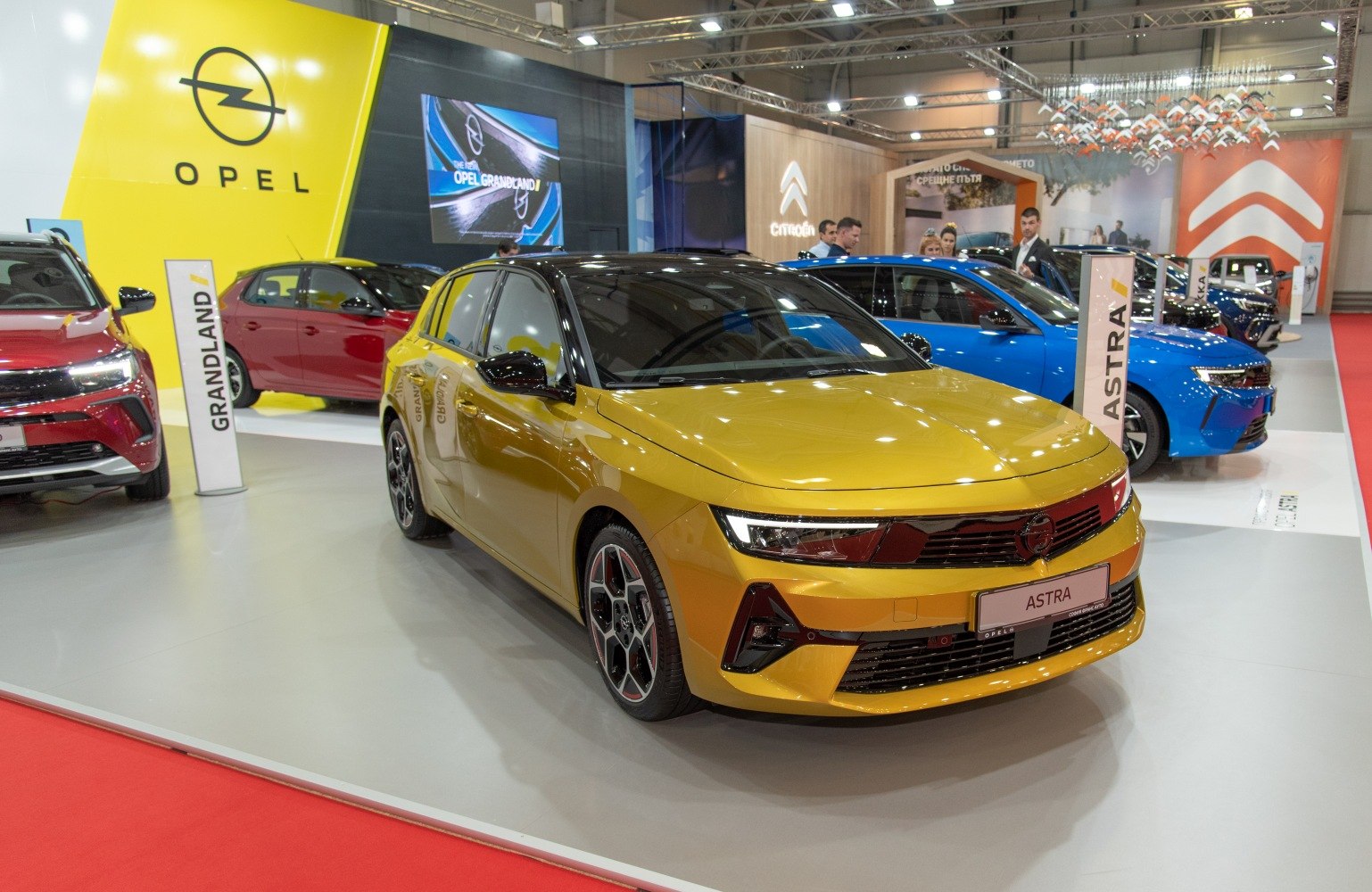 Modern hatchback with LED headlights and sporty multi-spoke wheels