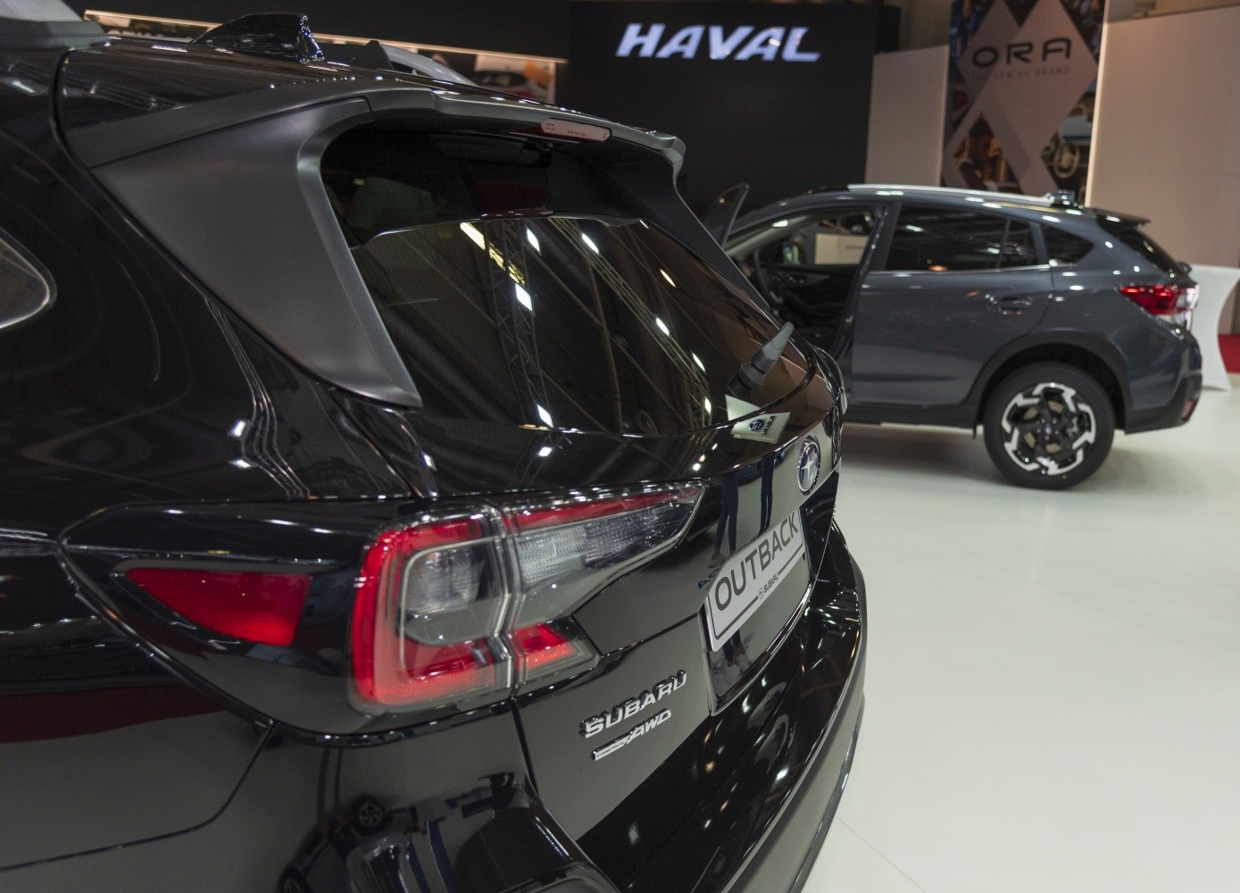 Rear view with LED tail lights and rear window spoiler on black SUV
