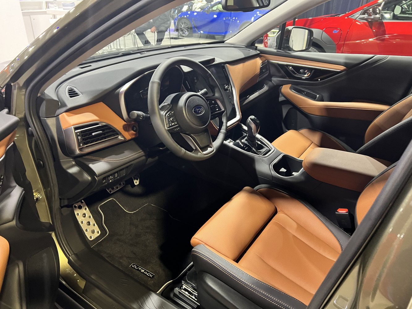 Brown leather seats and modern dashboard interior setup