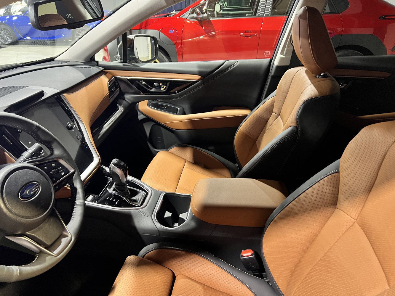 Brown leather seats and modern dashboard with center console