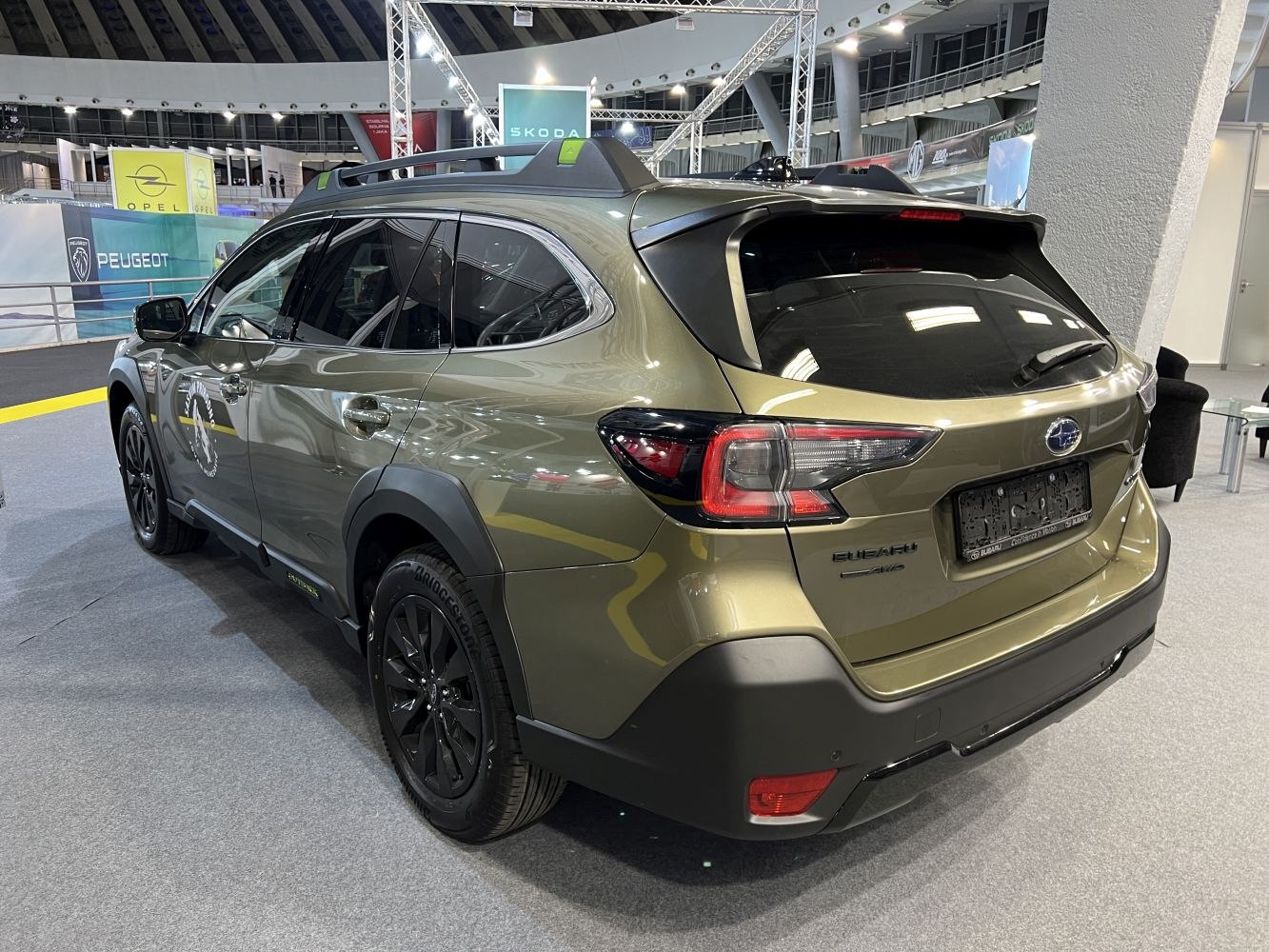 Rear side view of SUV with black wheels and modern taillights