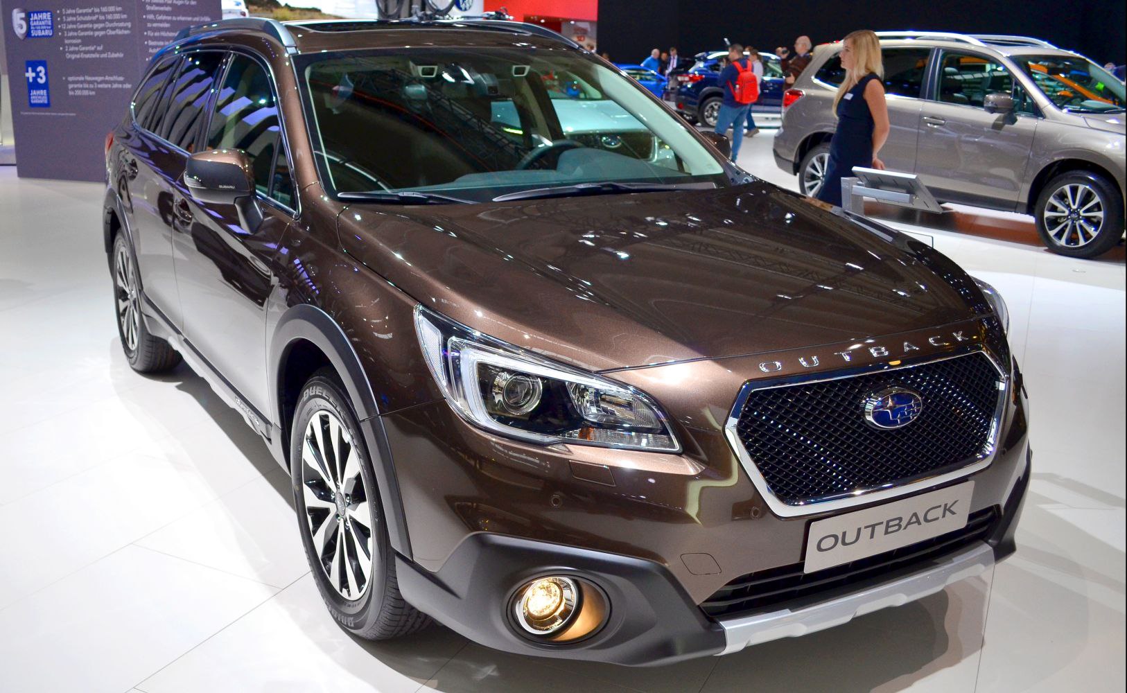 Front view with LED headlights, mesh grille, and alloy wheels.