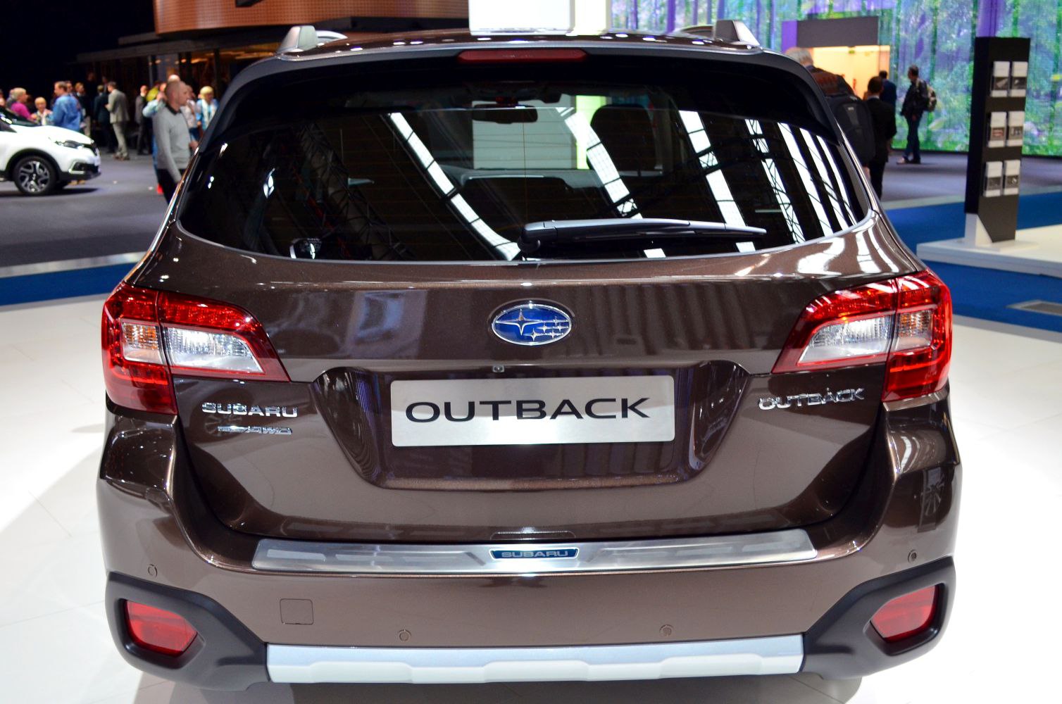 Rear view with prominent taillights and rear windshield wiper