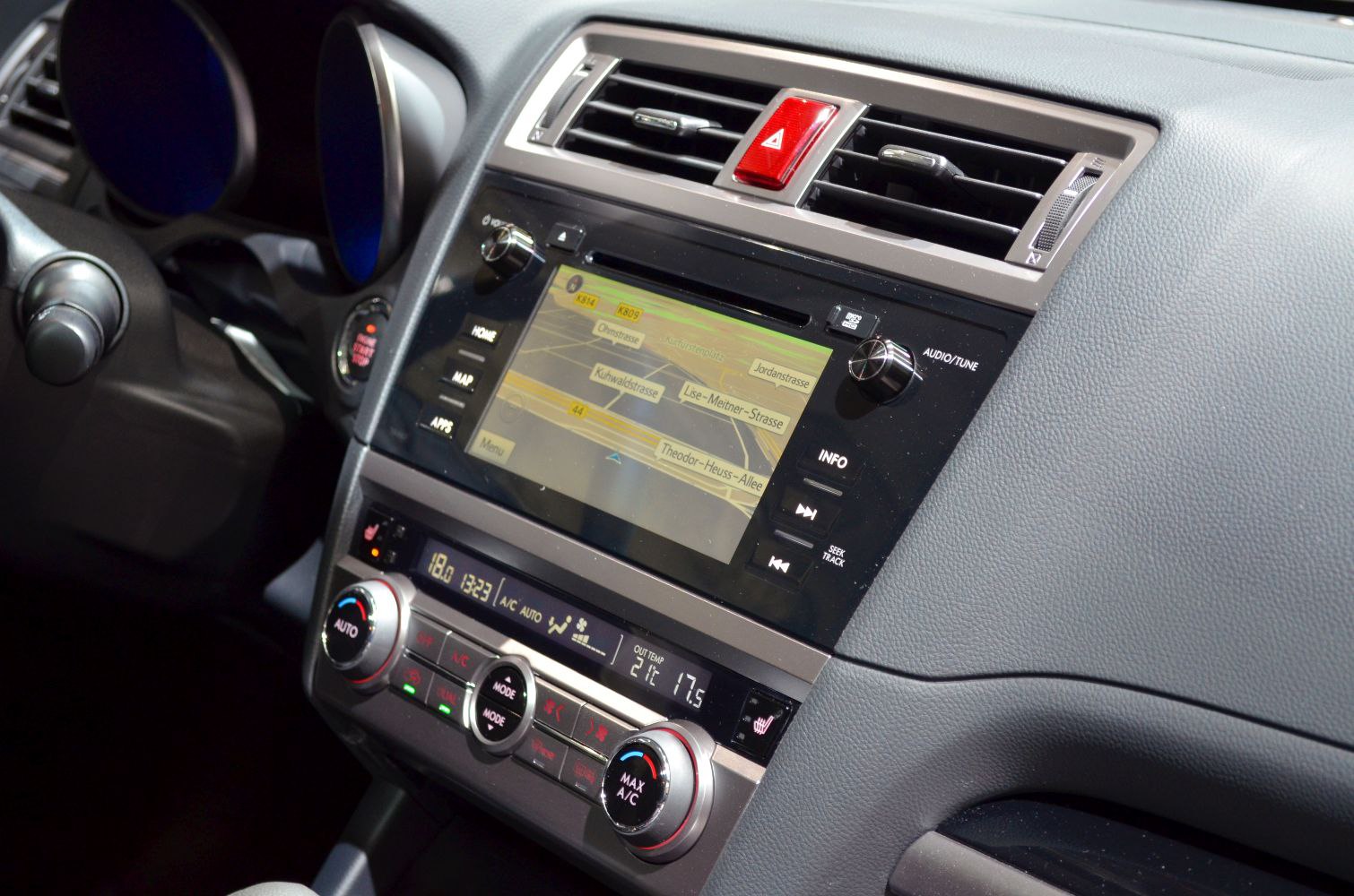 Car dashboard with touchscreen navigation and dual-zone climate control