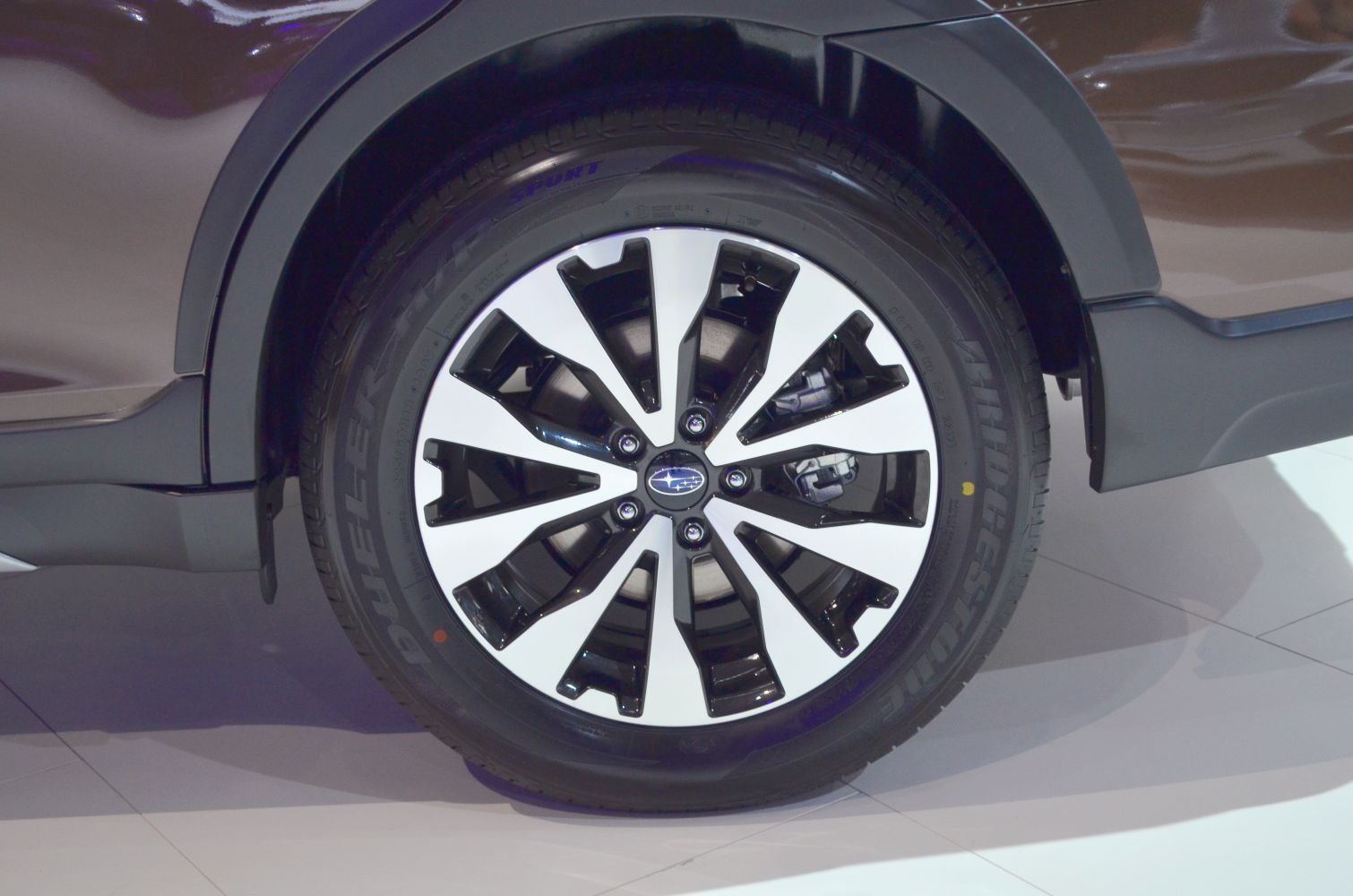 Alloy wheel with Bridgestone Dueler tire and wheel arch trim