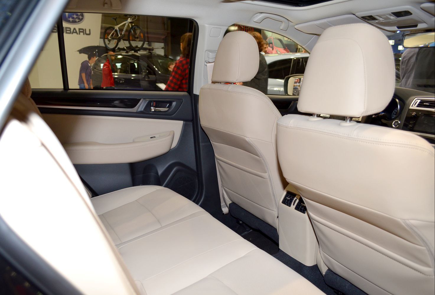 Beige leather rear seats and spacious rear passenger area