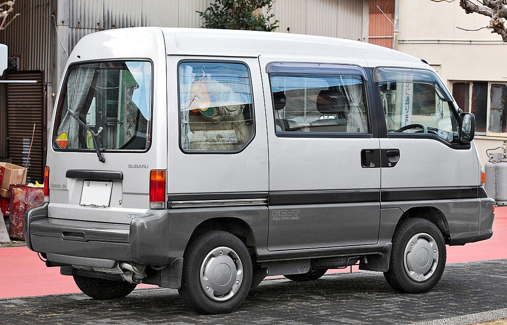Side profile of a compact minivan with sliding door and rear window wiper