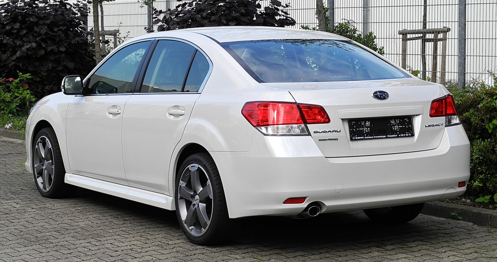 Rear view with taillights and alloy wheels