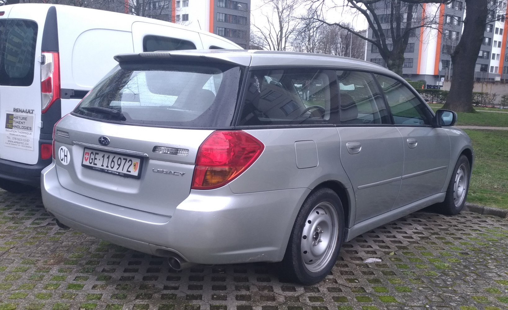 Silver station wagon rear with distinctive taillights and hatchback design