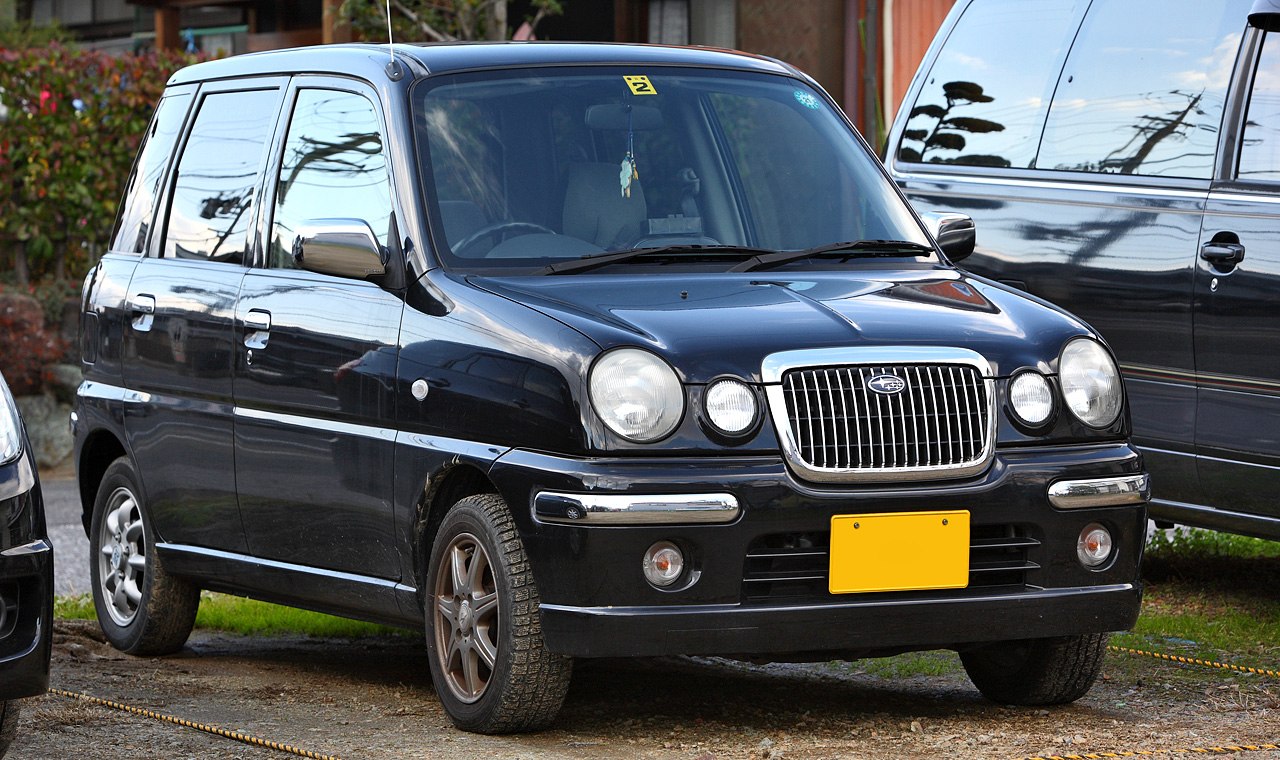 Compact hatchback with distinctive grille and round headlights