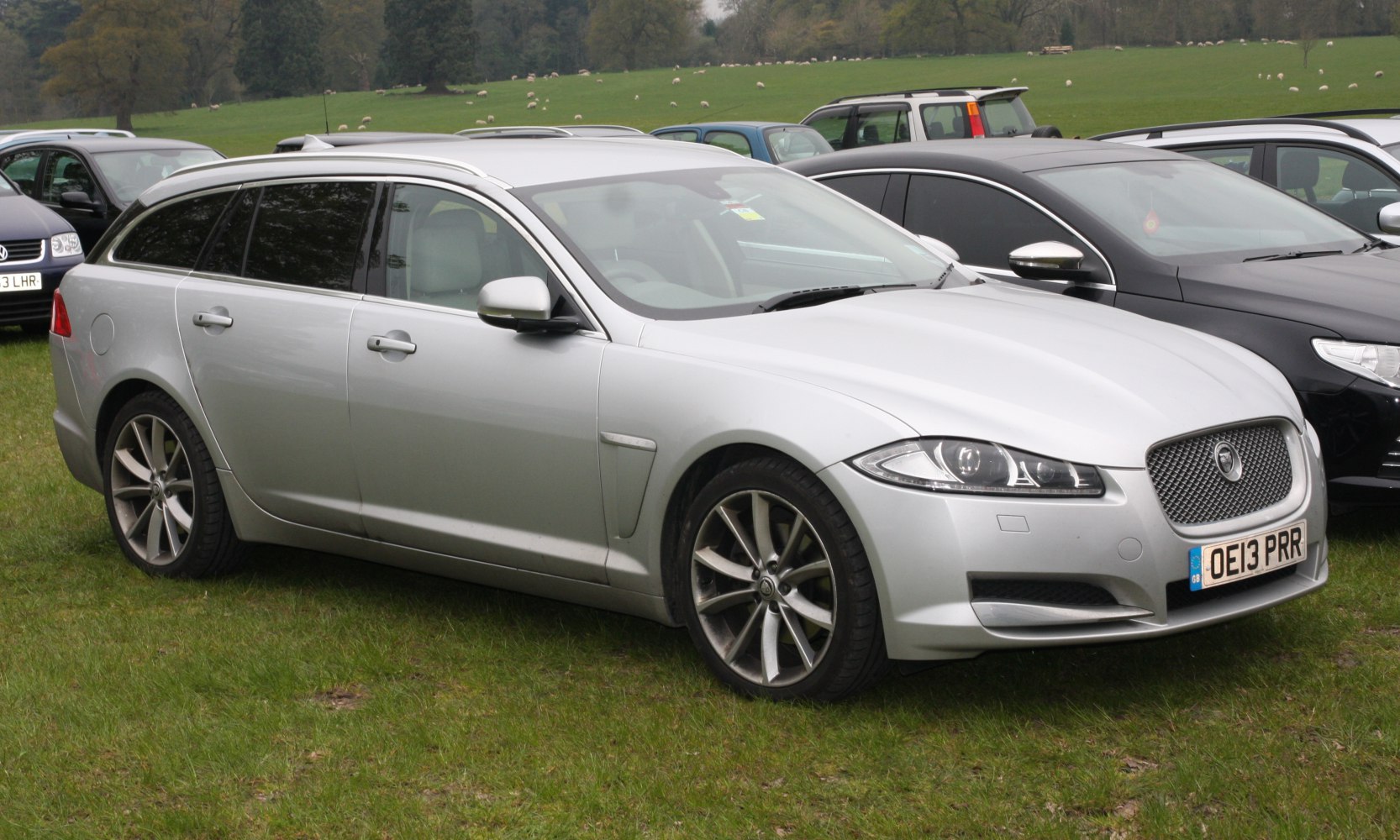 Silver station wagon with alloy wheels and prominent front grille