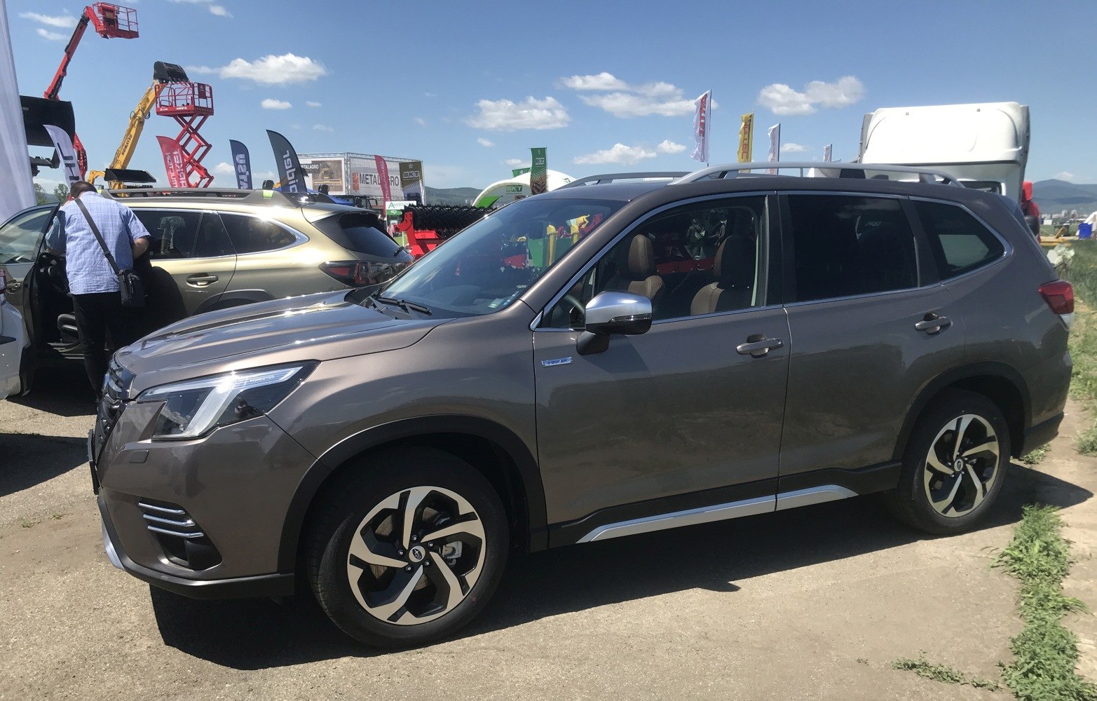 SUV side profile with alloy wheels and roof rails