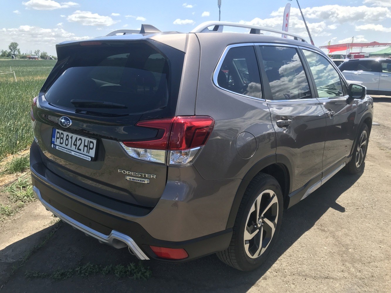 Rear side view of a modern SUV with distinct taillights and alloy wheels