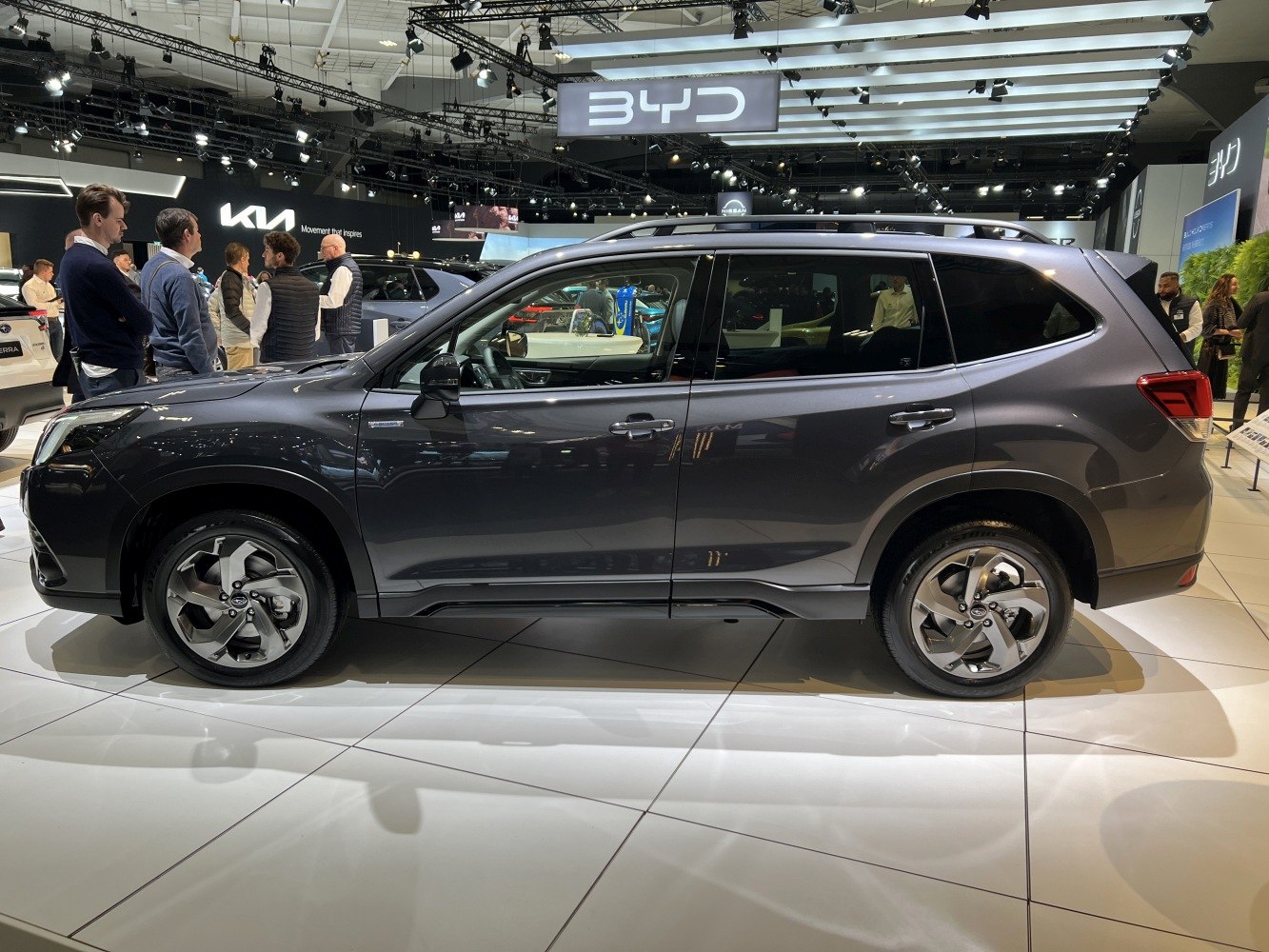 Side view of modern SUV highlighting alloy wheels and roof rails.