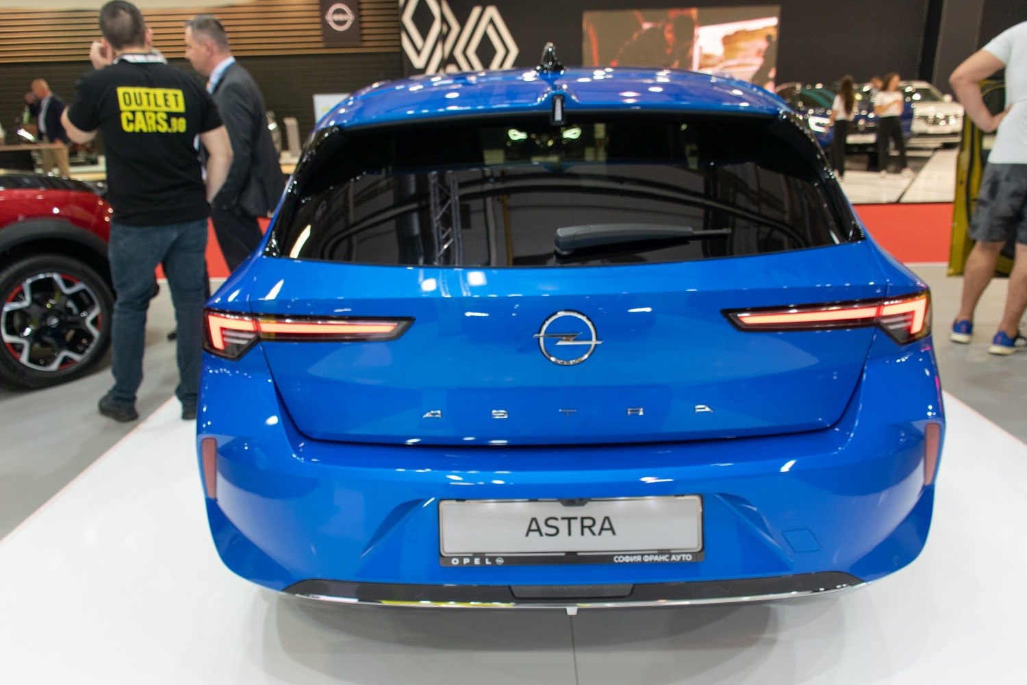 Bright blue hatchback rear with sleek LED taillights and rear window wiper