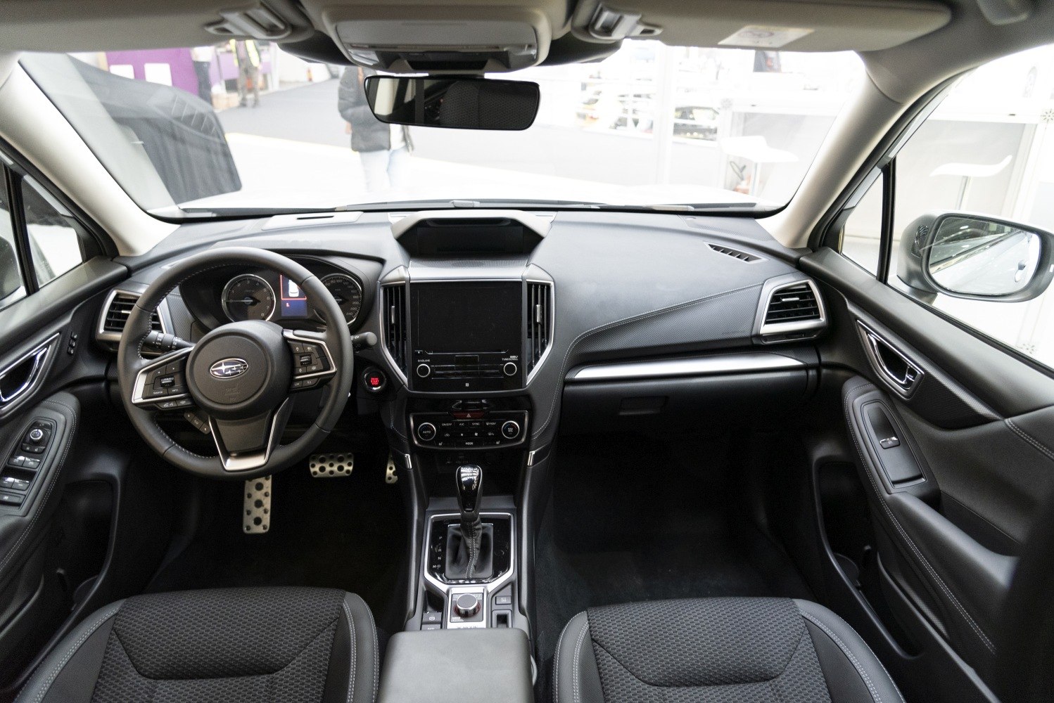 Modern car interior with dashboard and multifunction steering wheel