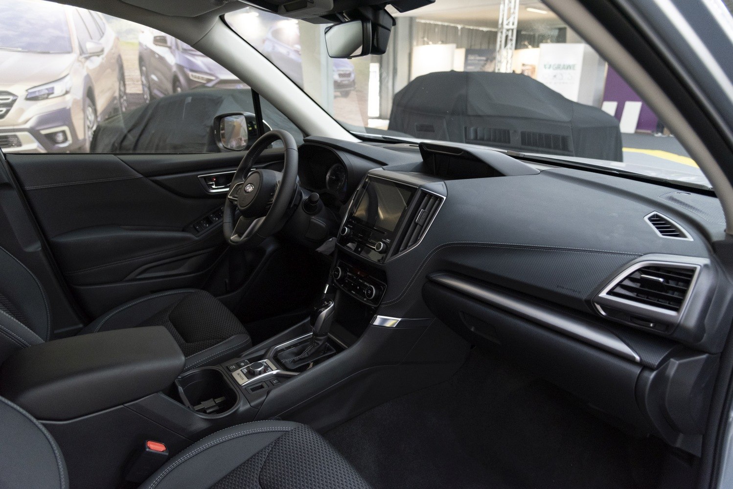 Modern spacious car interior with touchscreen dashboard and ergonomic center console