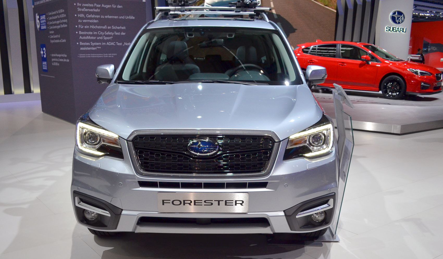 Front view of a modern SUV with grille and LED headlights.