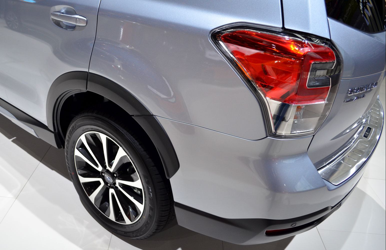 Rear quarter showing alloy wheel and taillight