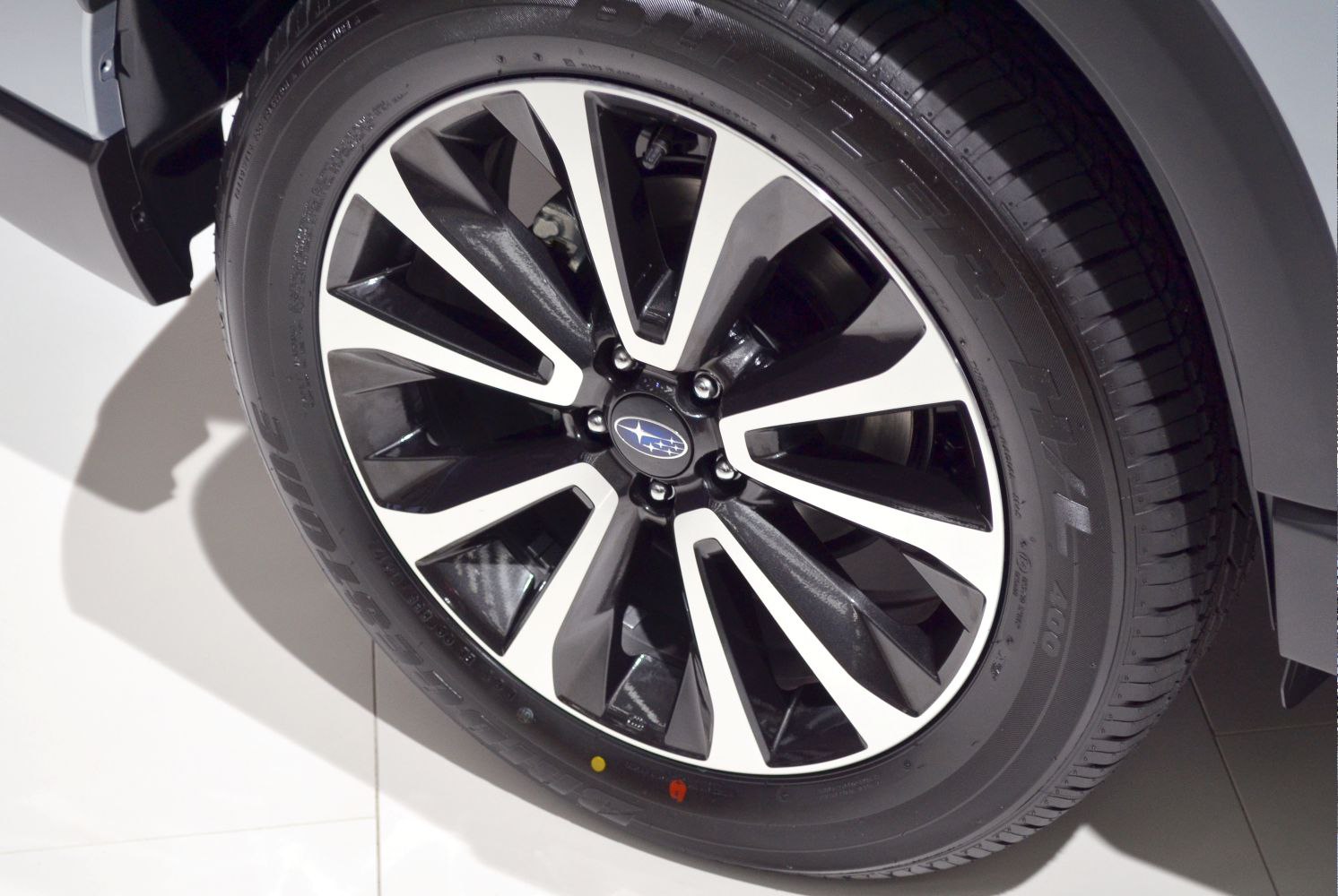 Multi-spoke alloy wheel and tire close-up with modern design