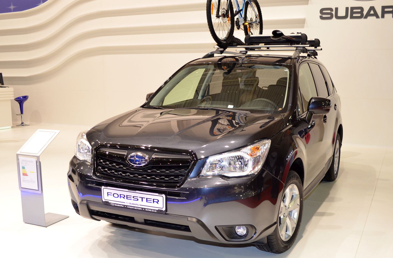 SUV front view with roof-mounted bike rack and black finish