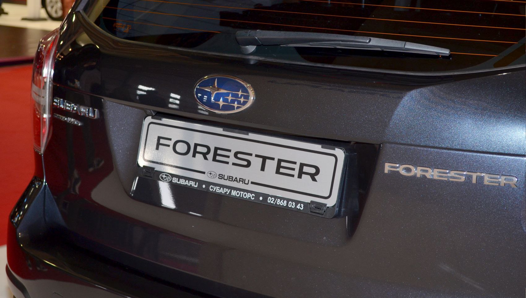 Rear badge, Subaru emblem, and rear windshield wiper on tailgate