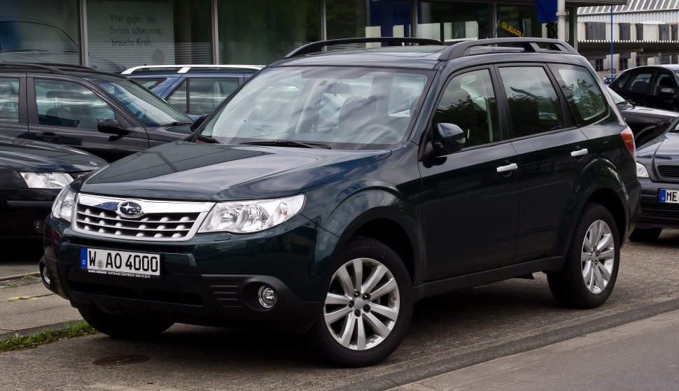 SUV front-side view with grille, headlights, and alloy wheels