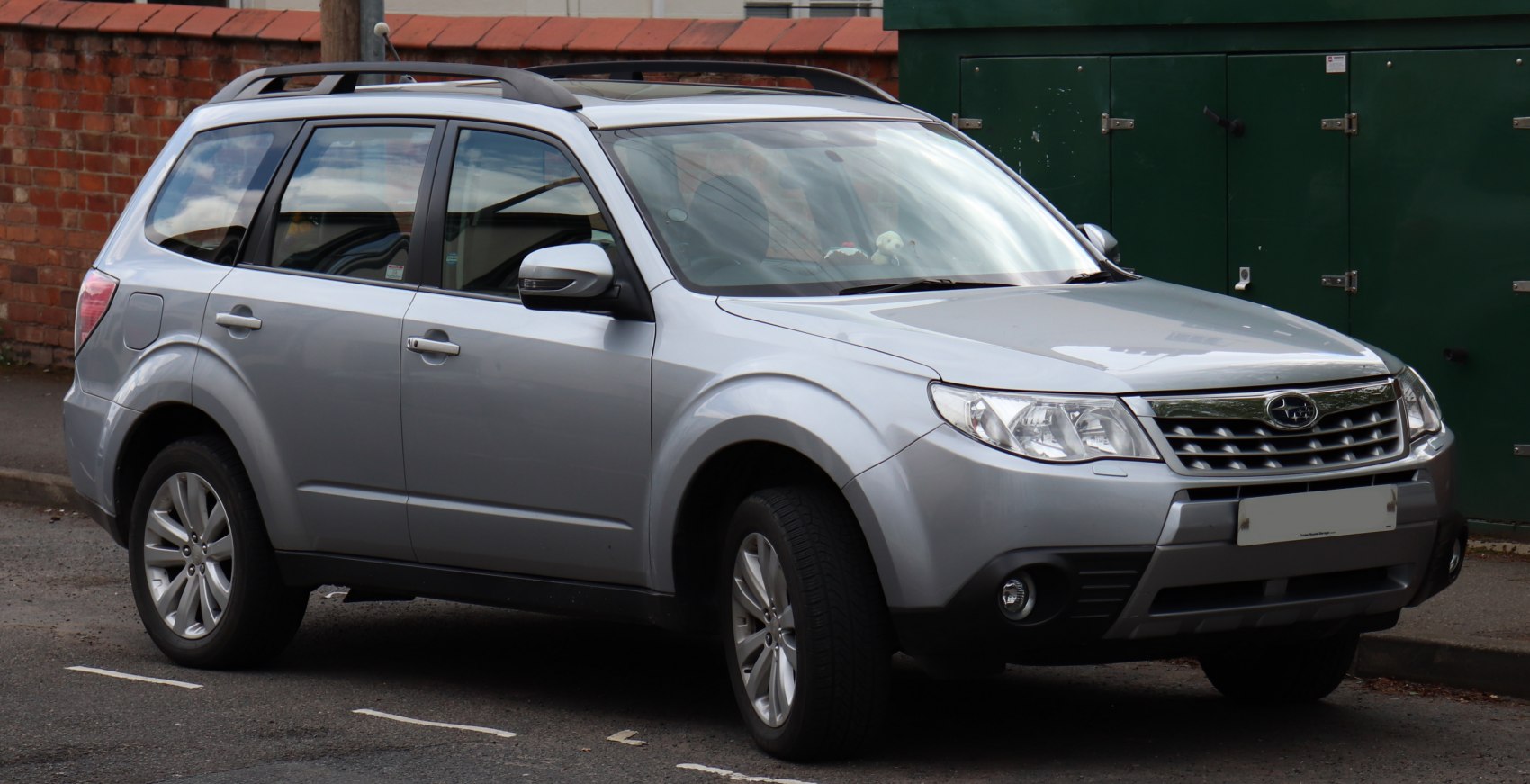 Silver compact SUV with rugged body cladding and roof rails