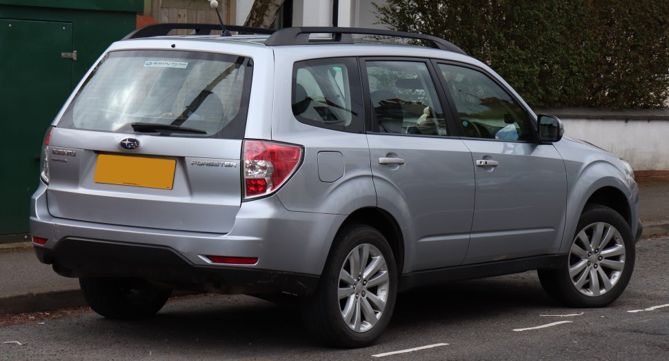 Silver SUV rear side view with roof rails and rear window wiper