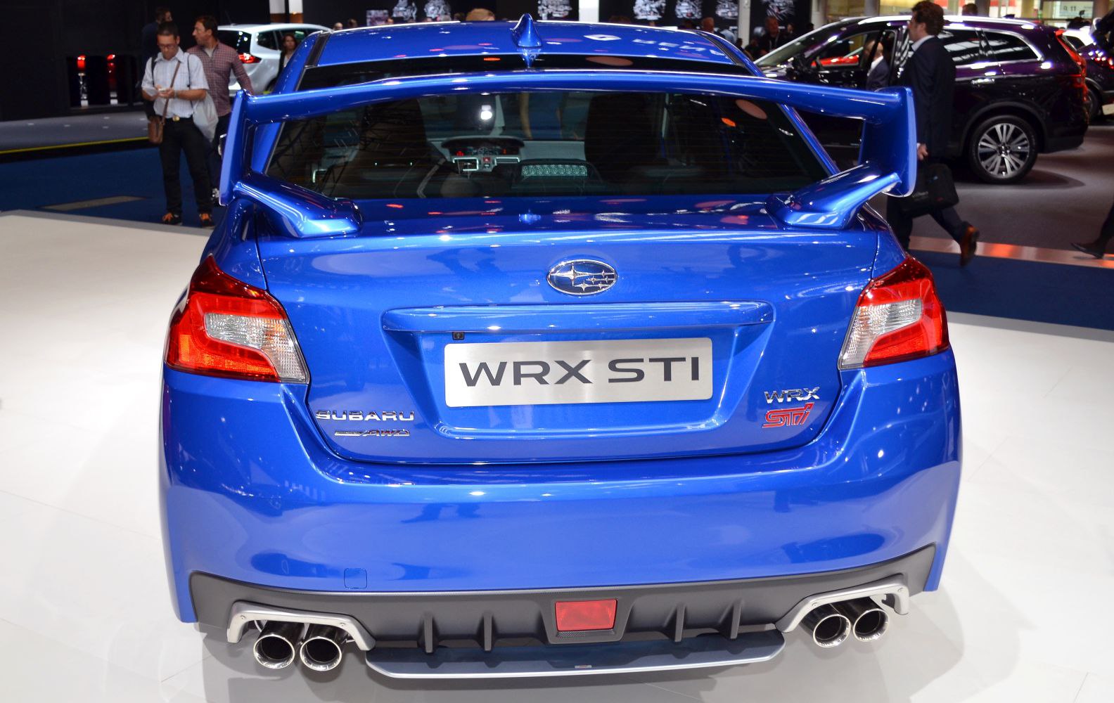 Rear view with large spoiler and quad exhaust tips