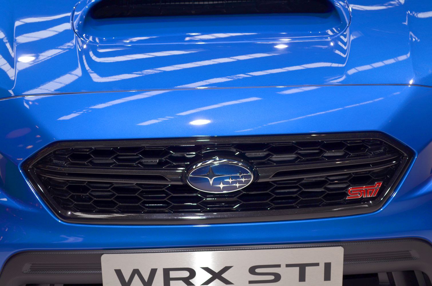 Front grille with Subaru and STI badges on blue hood
