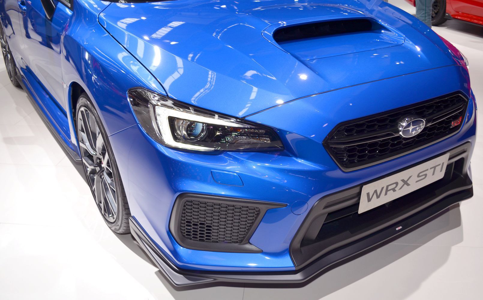 Close-up of aggressive front end with LED headlights and hood scoop