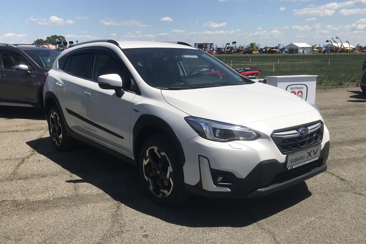 White modern SUV with LED headlights and black wheel arches