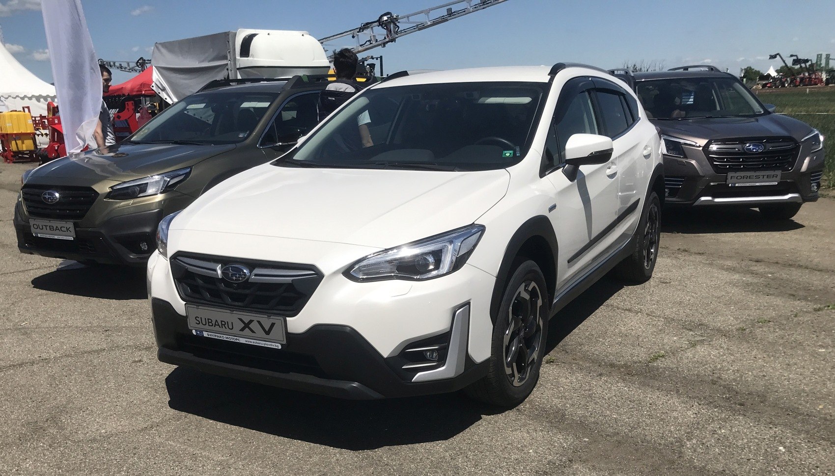 White crossover SUV with sleek headlights and prominent front grille