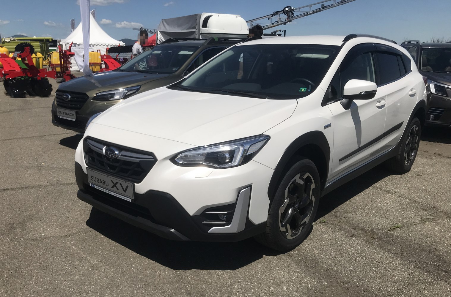 White SUV front-side with modern headlights and alloy wheels