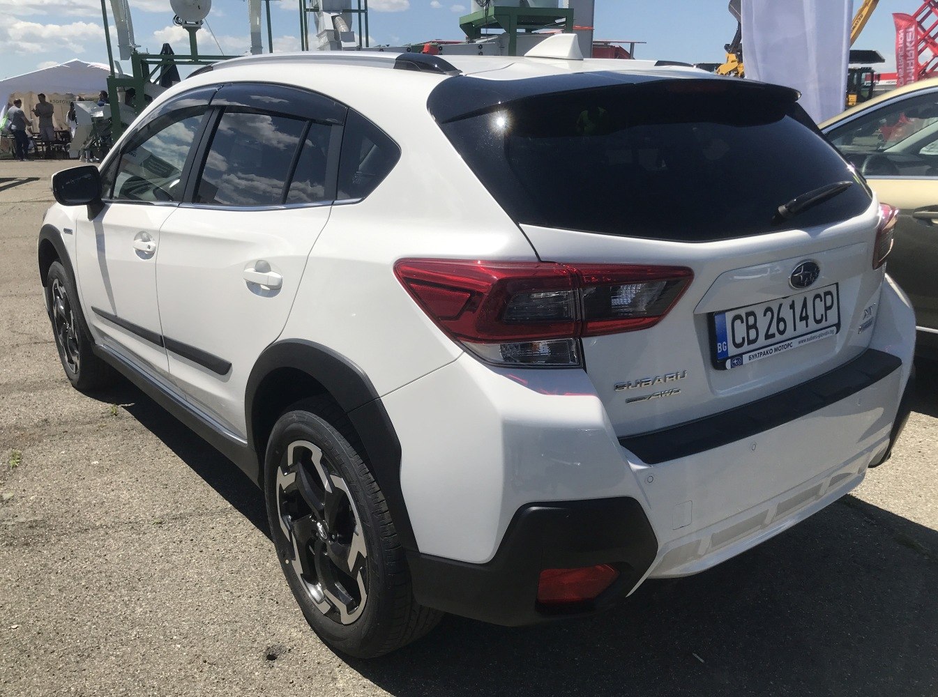 Sharp rear taillights and black bumper accents on white compact crossover