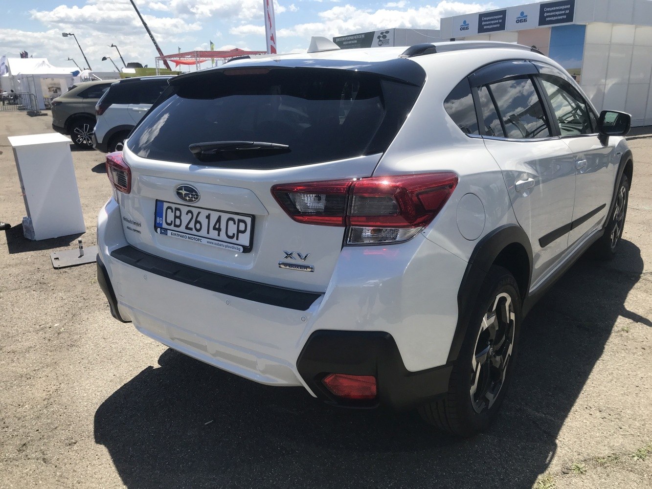 Rear design with taillights and rear hatch of a white modern SUV