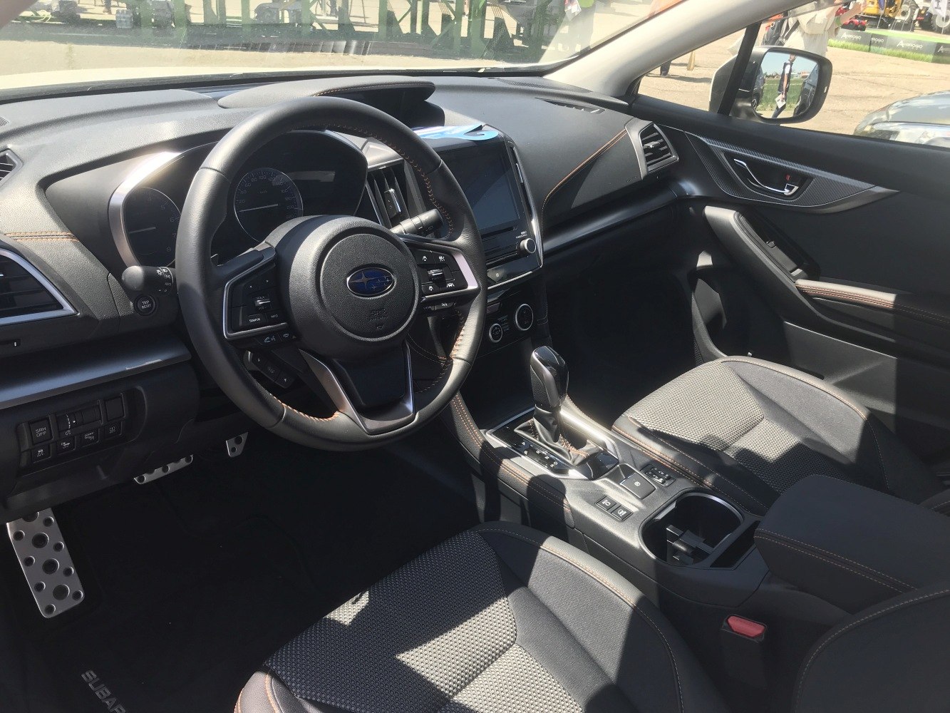 Steering wheel, dashboard, center console with gear shifter and controls
