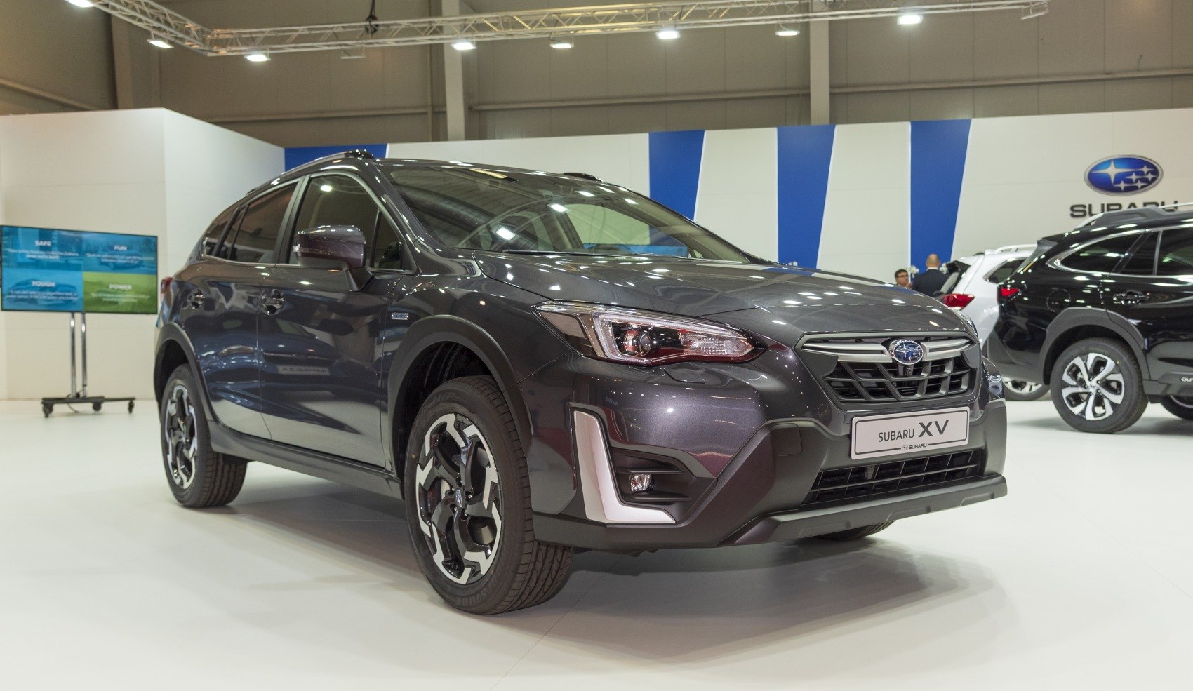 Front-angle view highlighting sharp headlights and alloy wheels.
