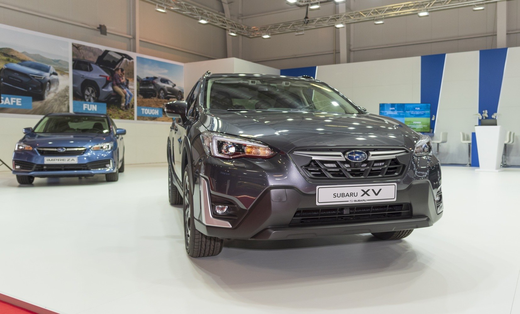 Front view of a modern SUV with distinct headlights and grille.