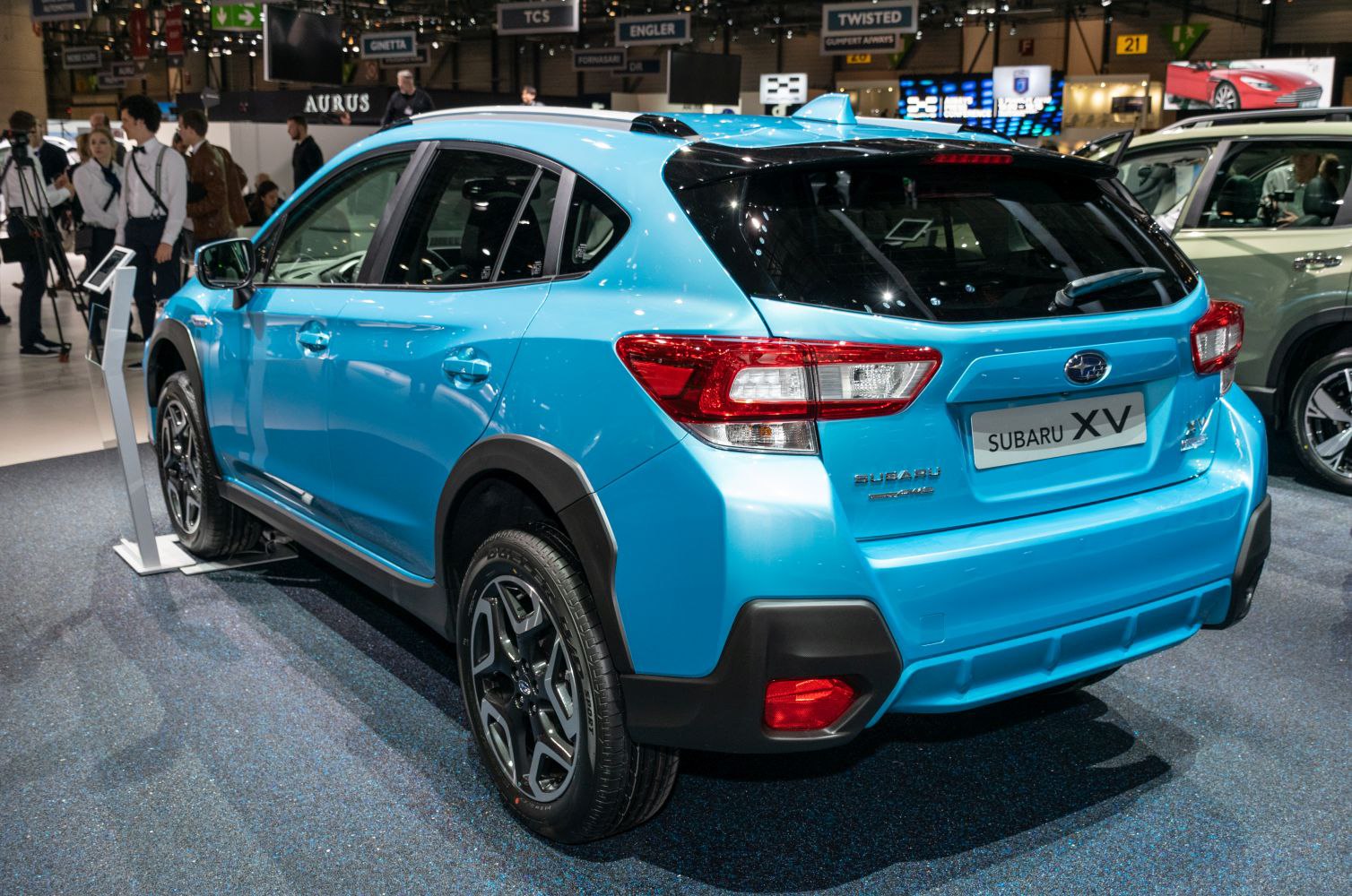 Rear and side view with taillights, alloy wheels, and sporty design