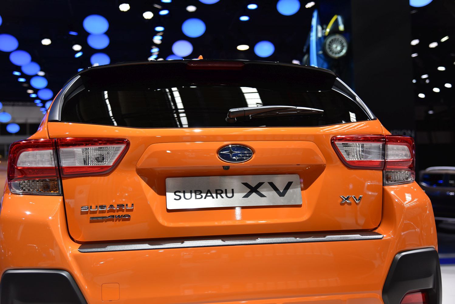 Rear view of SUV with AWD badge and distinctive tail lights