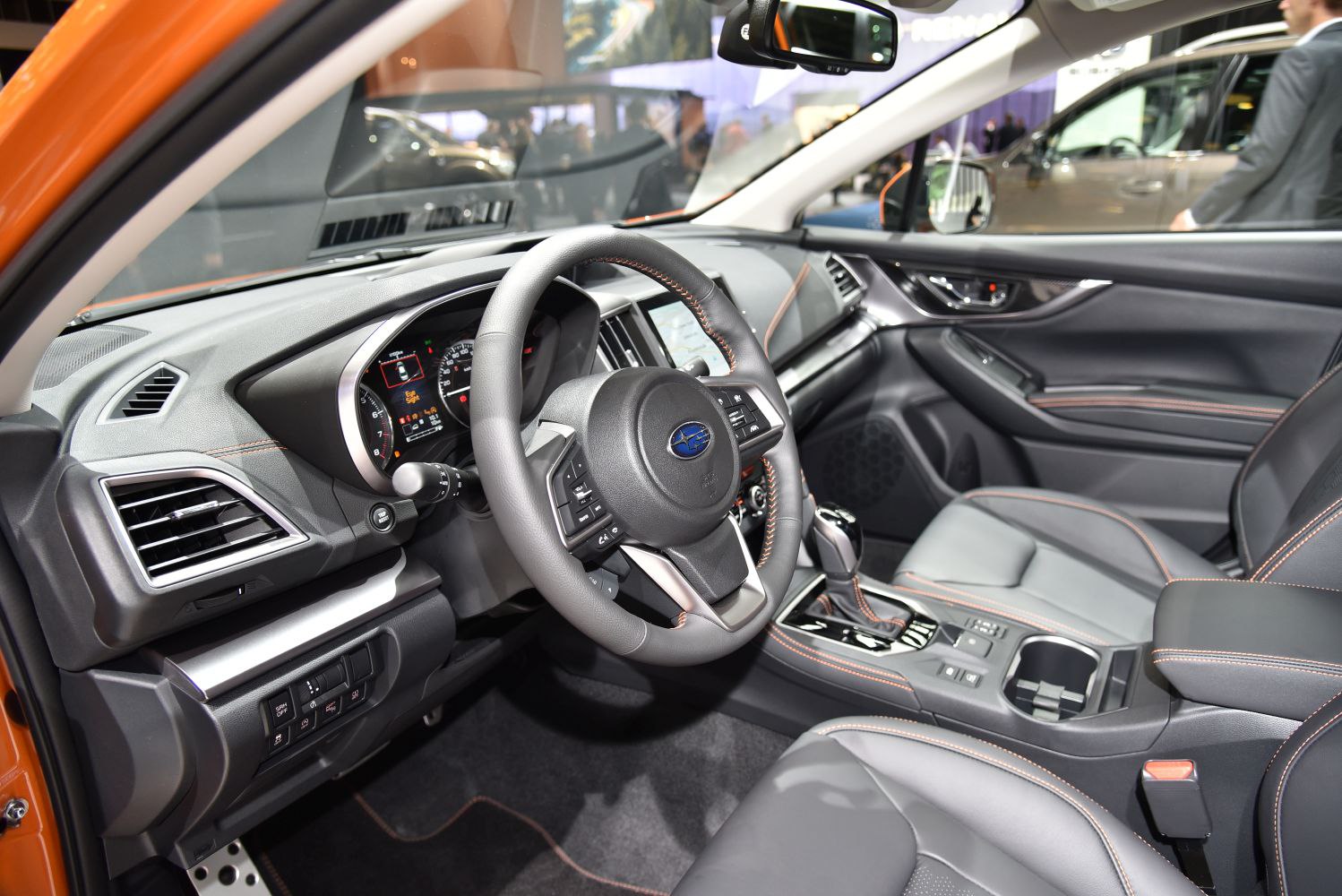 Modern car interior featuring dashboard and steering wheel with controls