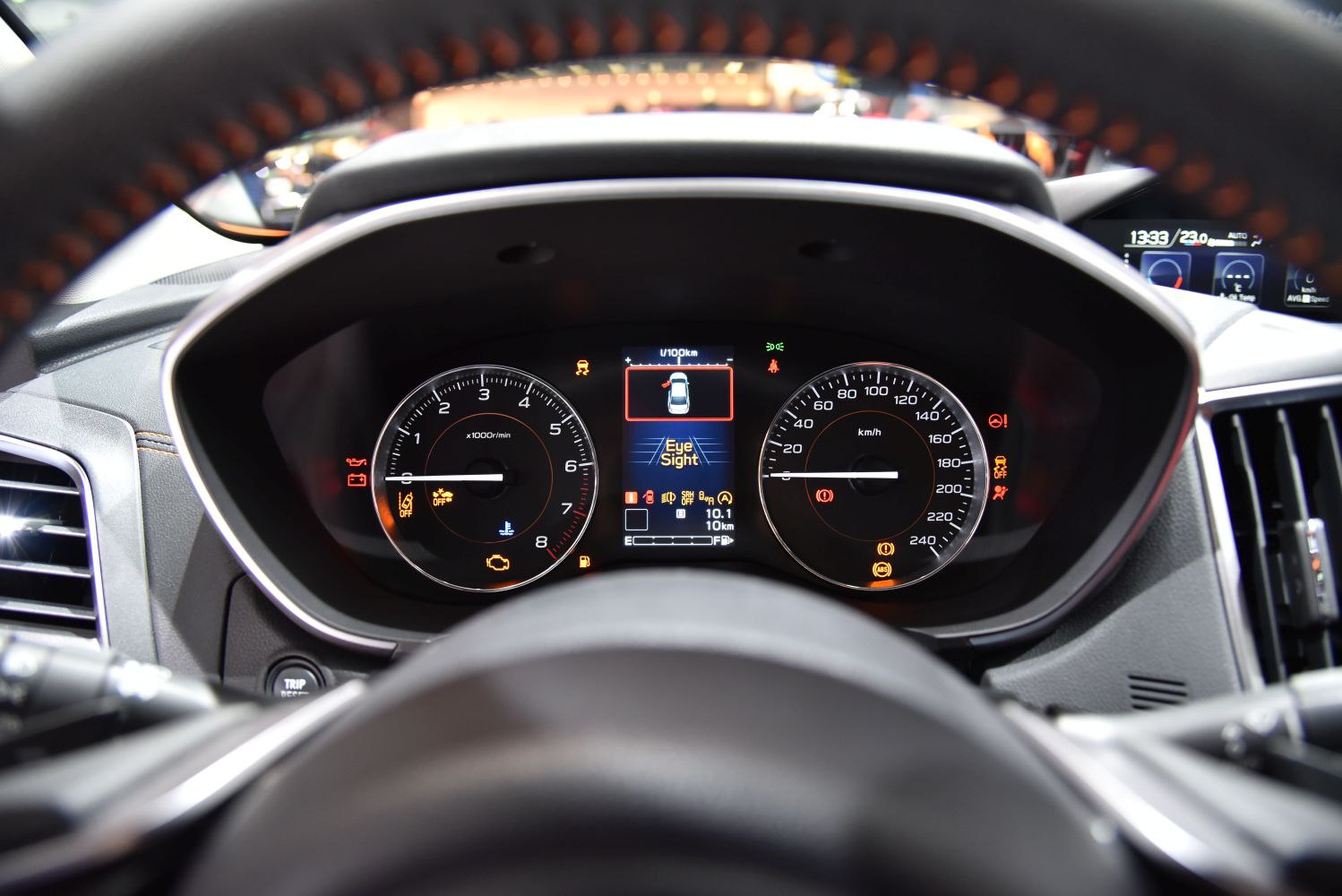 Instrument cluster with tachometer, speedometer, and digital EyeSight display