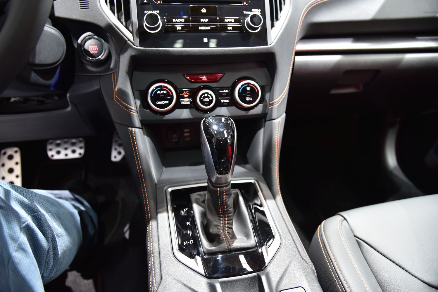 Center console with gear shifter and climate control knobs