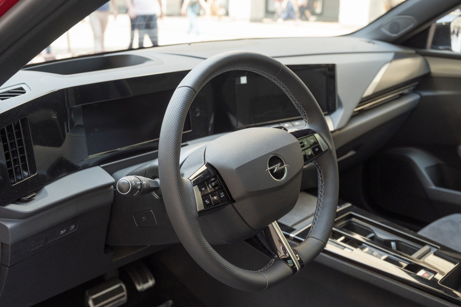 Modern steering wheel with buttons and a wide digital dashboard display