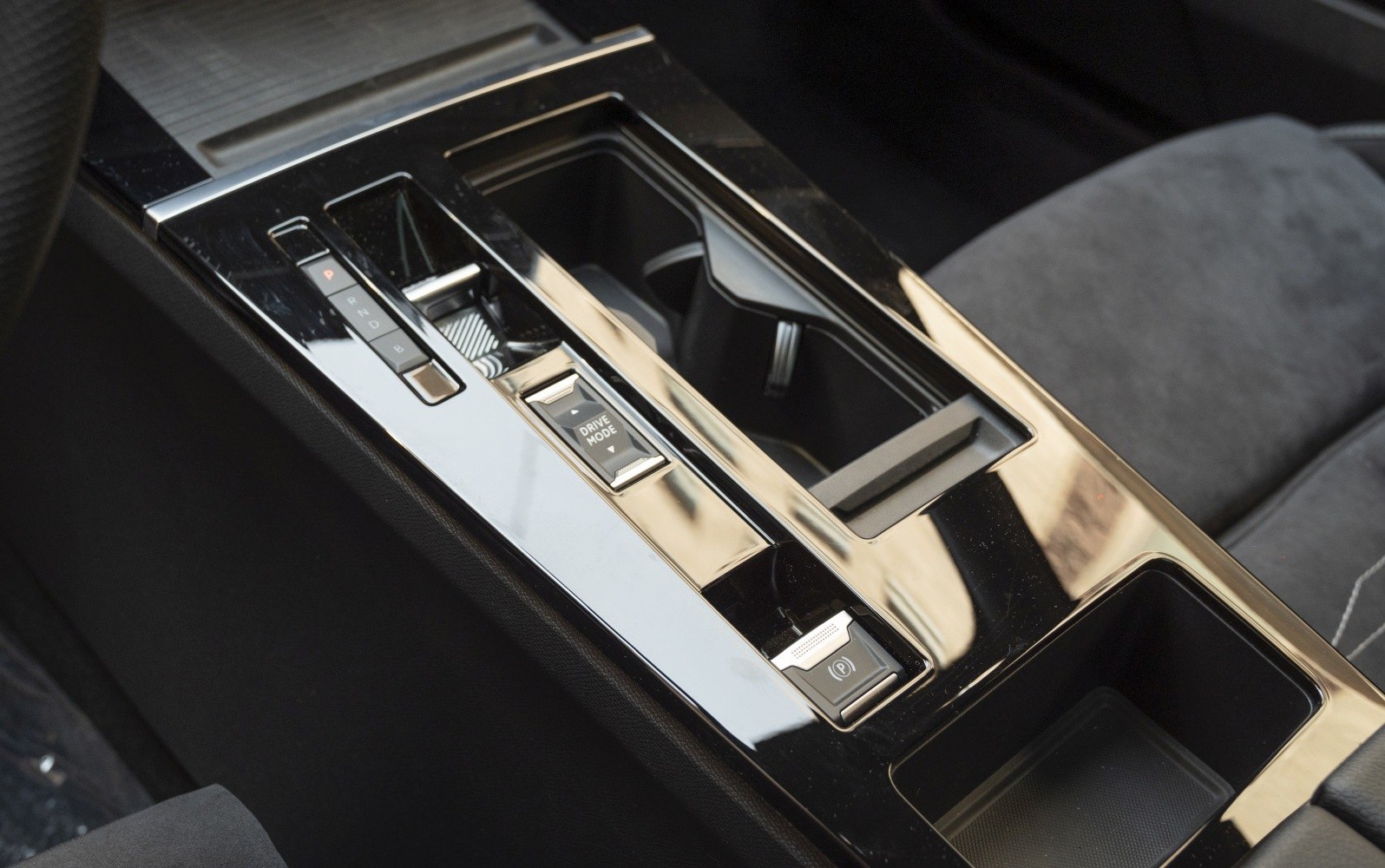 Center console with drive mode control and cup holders in modern car interior