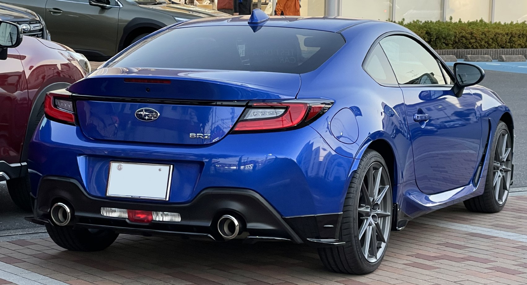 Rear view of a sporty coupe with dual exhaust and LED taillights