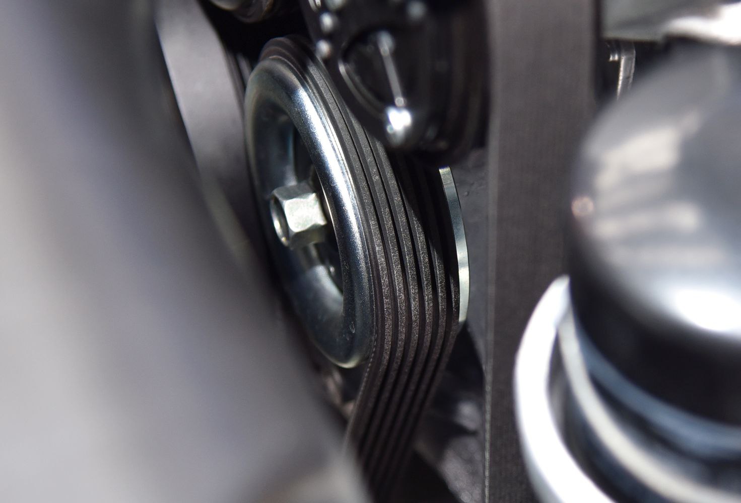 Close-up of engine drive belt and pulley
