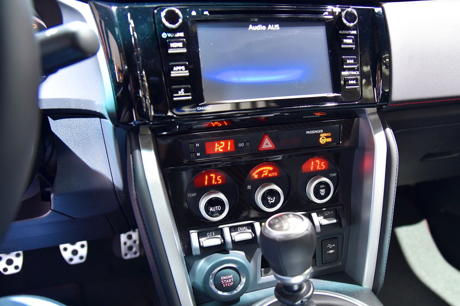 Interior control panel with digital climate control and infotainment screen